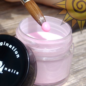 Acrylic nail powder in container with brush